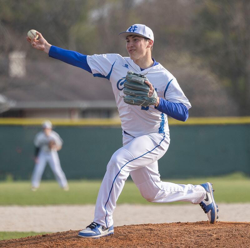 Newman’s Evan Bushman fires a pitch against Princeton Thursday, April 10, 2025.