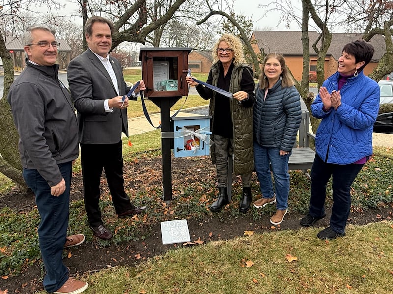 Fox Valley Hands of Hope in Geneva established two wind phones – one for adults and one for children, where grieving people can talk to their lost loved ones. FVHH Executive Director Jonathan Shively, (left), Mayor Kevin Burns, and wind phone committee members Lisa Safran, Kim North Byrne and Lynda McGrath cut the ribbon for the wind phones Thursday, Nov. 20, recognized as National Children's Grief Awareness Day.
