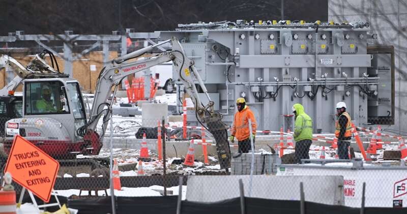 Crews work in the substation area of the new Compass Datacenters development on the former Sears headquarters site in Hoffman Estates.