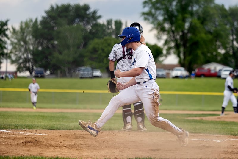 Newman’s Ashton Miner hollers after scoring a run in the first against Marengo Wednesday, May 28, 2025, in the Class 2A Sectional semifinal in Mendota.