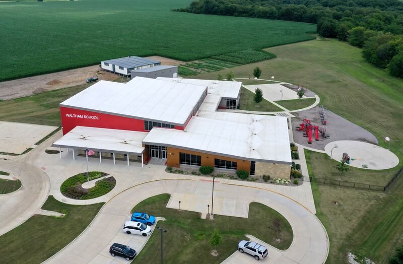 An aerial view of Waltham School on Monday, July 8, 2024 in Utica. Crews installed four 70 x 70 modular classrooms on the new property next to the school.  The school, built in 2018, has already outgrown its 240 student capacity and placed the four classrooms next to the school.