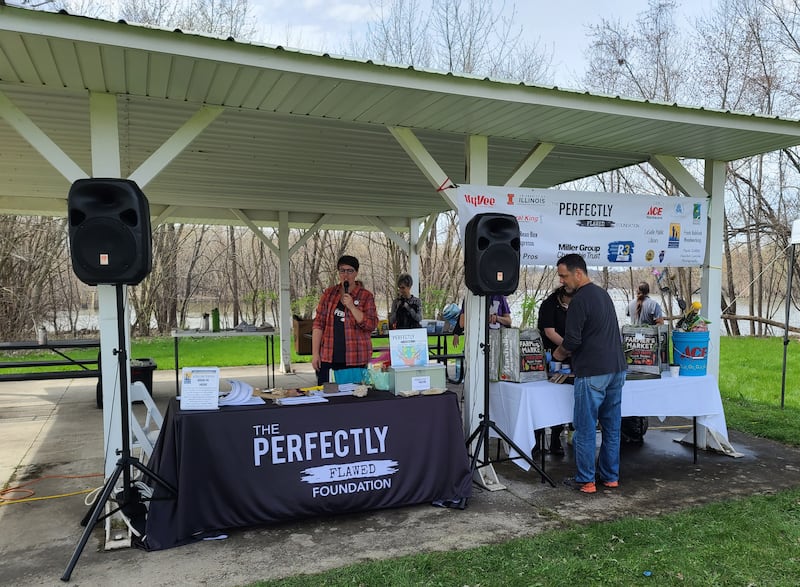 Natalie Martin, a volunteer with Perfectly Flawed Foundation, thanks people who attended the Earth Day Cleanup on Saturday. Twelve miles of walkway along the Illinois-Michigan Canal starting at the Lock 14 Shelter near La Salle were spruced up.