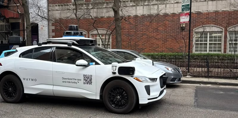 A Waymo vehicle drives through Chicago’s Near North Side on March 20 as the company begins testing and mapping the city.