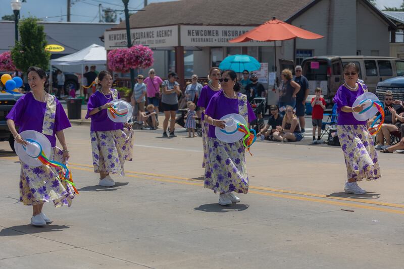 The Sauk Valley Filipino-American Association performs a dance during the Petunia Festival Parade on Sunday, July 7, 2024.