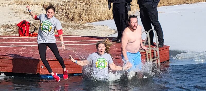 Three more members of the Simon's Squad jump into frigid waters at the Penguin Plunge Saturday, Jan. 25, 2025 at Skydive Chicago in Ottawa. Simon's Squad raised $35,000 of the $106,000 raised by the event.