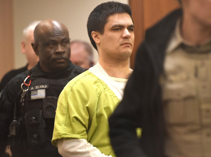 Jonathan Gounaris is escorted into an Ogle County courtoom on Wednesday, Feb. 4, 2026 by Ogle County and Winnebago County sheriff deputies. He is charged with shooting three Ogle County police officers during a June 2024 incident at his home in rural Dixon. He is being held in the Winnebago County Jail as his attempted murder case proceeds through the court system.