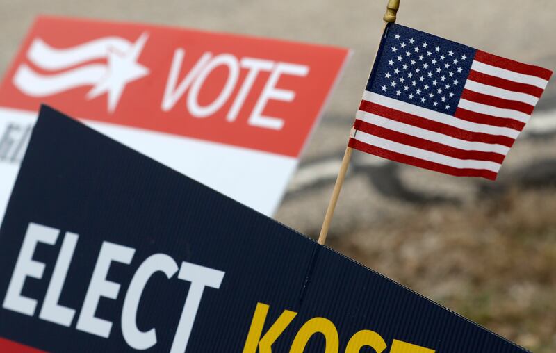 An American flag on a campaign sign on Tuesday, April 1, 2025. in front of the Spring Grove Village Hall.