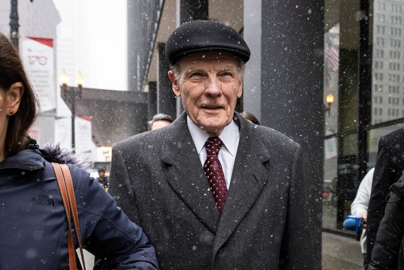 Flanked by supporters and holding hands with his daughter Nicole, Illinois' former House Speaker Michael Madigan walks out of the Dirksen Federal Courthouse in Chicago, Wednesday, Feb. 12, 2025. (Ashlee Rezin/Chicago Sun-Times via AP)