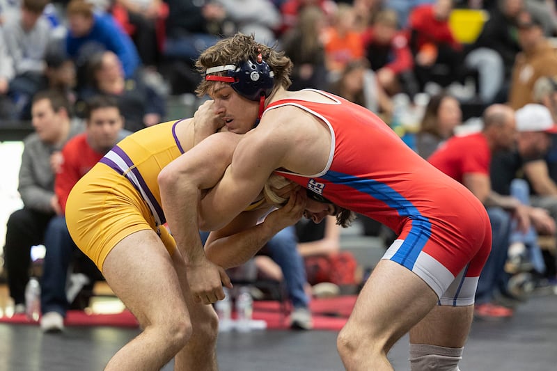 Sherrard’s Cooper Thomas (left) and Morrison’s Noah Stout face off in the 190 pound finals Saturday, Jan. 31, 2026, during the Class 1A Wrestling Regionals at Riverdale High School. Stout won by pin.