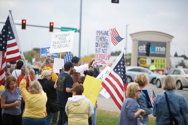 Locals gather at the NO Kings rally along Randall Rd. on Saturday, Oct.18,2025 in Geneva.