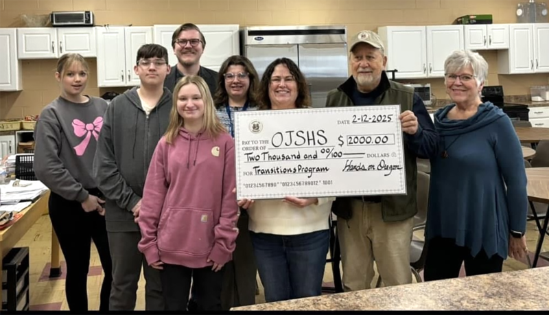 In the front row, left to right, are: Teagan Harrell (student), Wendy Stevens (teacher), Lee Hadick (HOO president), and Cindy Klug (HOO member). Back row: Reiannah Jenkins (student), Kainen Gonzalez (student), Chance Munroe (Oregon Chamber Executive Director), and Sarah Blackburn (student).
