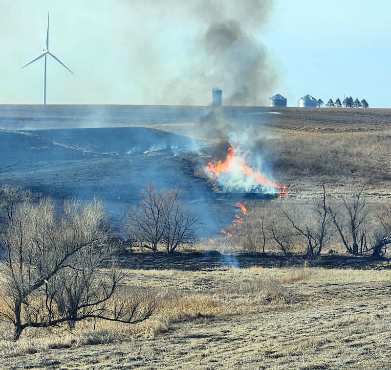 Fire burns approximately 25-30 acres of a farm field near 270th and Lewis Avenue southwest of Greenfield Wednesday, March 12. Fontanelle and Greenfield firefighters were dispatched to the scene to help bring the fire under control.