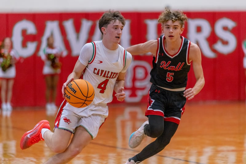John Sowers of LaSalle-Peru High School drives the ball down the court against Hall defender Jacob Andracke during the game at Sellett Gymnasium on December 2, 2025 at LP High School.