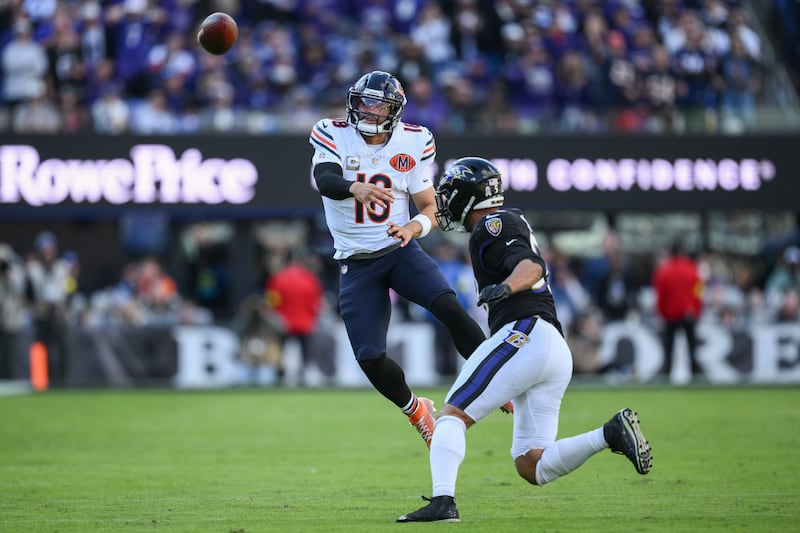 Chicago Bears quarterback Caleb Williams (18) passes over Baltimore Ravens linebacker Kyle Van Noy (53) during the second half an NFL football game, Sunday, Oct. 26, 2025, in Baltimore. (AP Photo/Nick Wass)