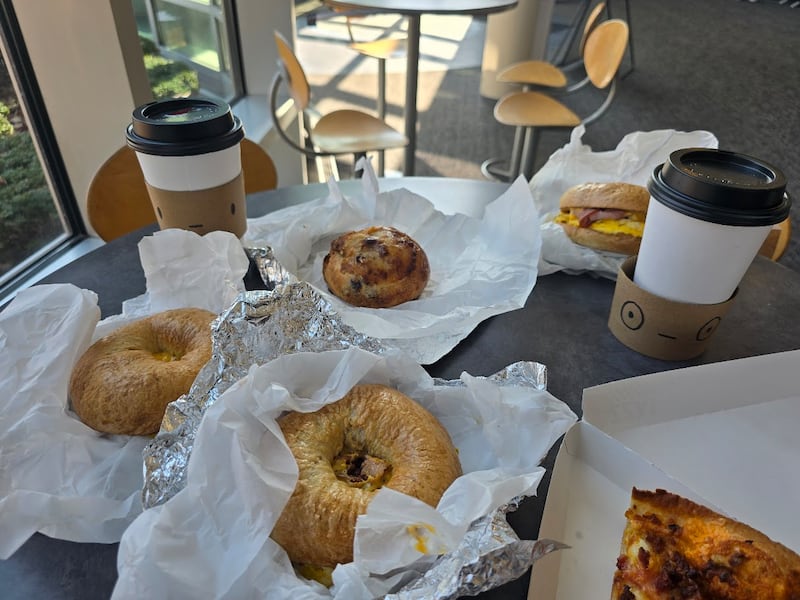 A variety of breakfast bagels, along with coffee and a slice of breakfast pizza, are seen at the recently opened Cup of Joe by Cemeno's, located inside the Inwood Recreation Center at 3000 W. Jefferson St. in Joliet, and near Cemeno's Pizza At the Park, is seen on Sunday, Feb. 15, 2026.