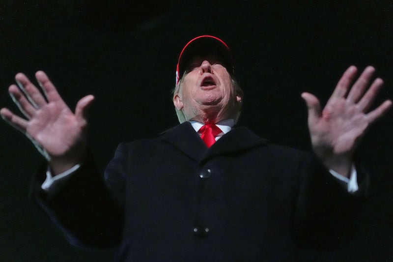 President Donald Trump speaks with reporters at Joint Base Andrews, Md., Sunday, April 12, 2026, after he returned from Miami. (AP Photo/Julia Demaree Nikhinson)