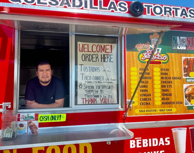 Owner Angel Mendoza stands ready to greet customers inside the Mendoza Tacos Food Truck at the corner of West 10th Street and First Avenue in Rock Falls, Illinois, on June 27, 2025.
