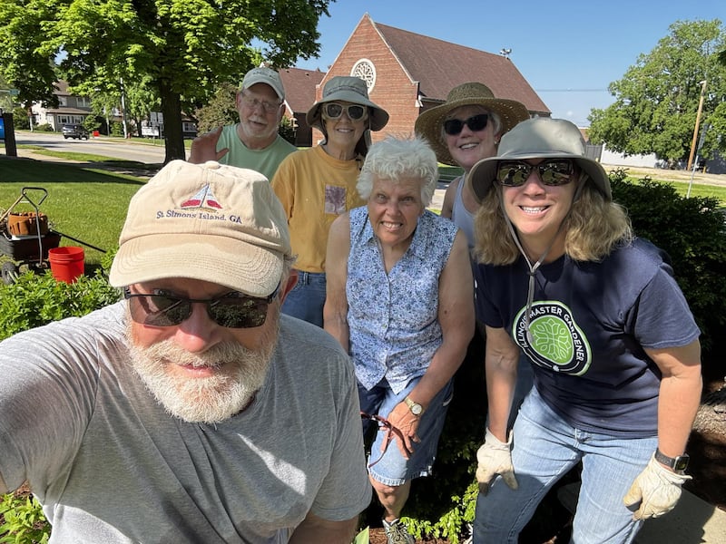 Volunteers from the Master Gardener program work together to maintain gardens at the Marshall-Putnam Fairgrounds and County Courthouse.