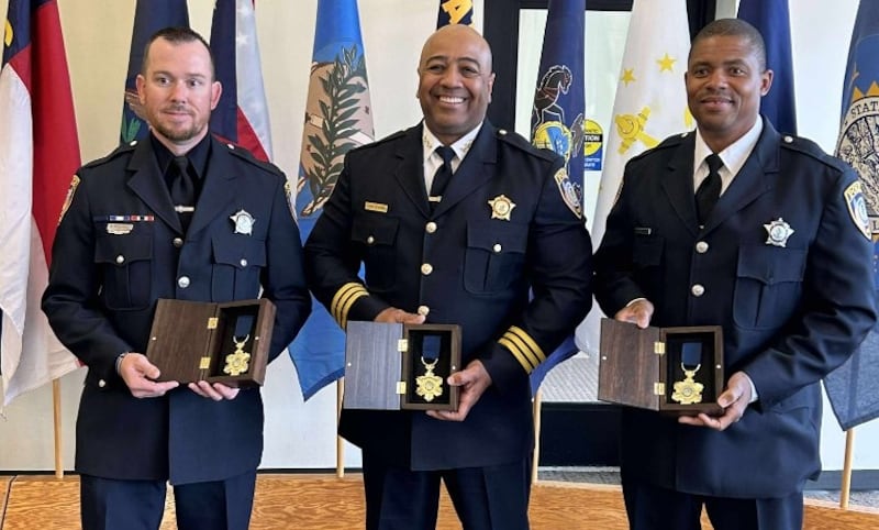 (From left) DeKalb police officer Brian Bollow, Chief David Byrd and Sgt. Keunte Mallett pose with their Law Enforcement Medal of Honor, the state's highest accolade for police, after a ceremony on Thursday, May 28, 2025, in Springfield.
