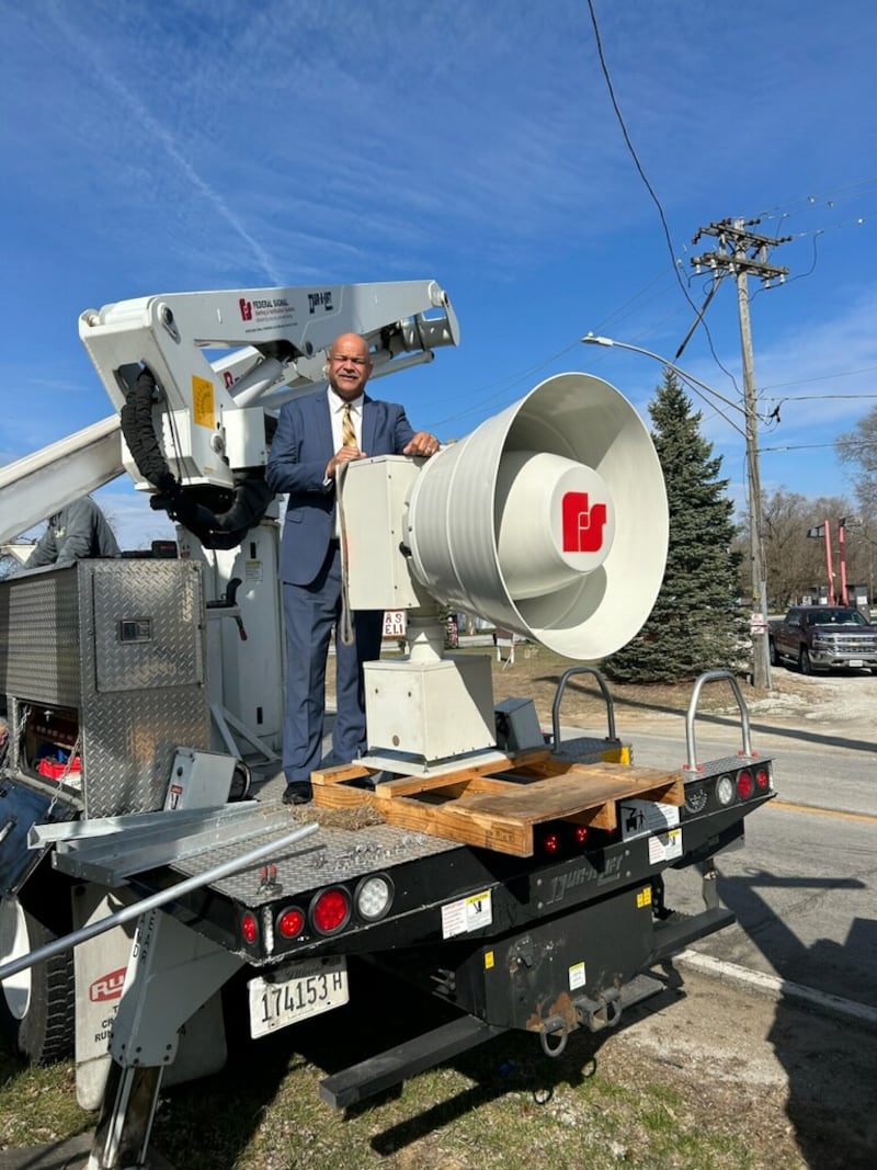 Hopkins Park Mayor Mark Hodge stands behind a new tornado siren that was installed in the village on Thursday, March 19, 2026.