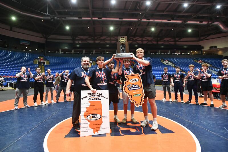 Marmion captains receive the Class 3A championship trophy at the IHSA Dual Team State Finals on Saturday, March 1.