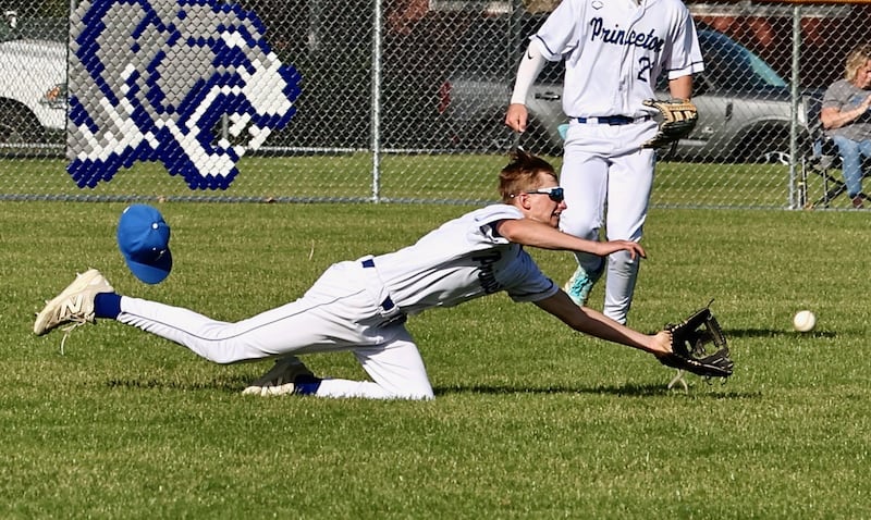 Princeton left fielder Reed Jesse lays out for a fly ball in Thursday's game at Prather Field in Princeton against Seneca. The Irish won 8-6.