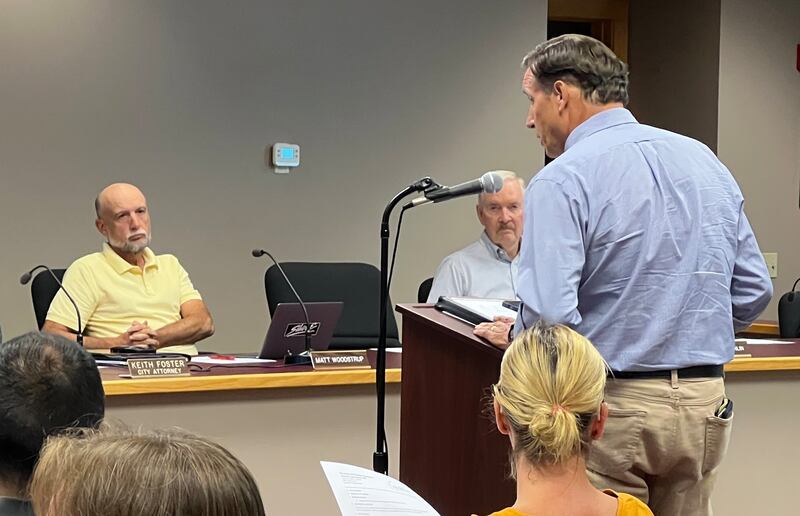 Syamore planning and zoning commissioners Matt Woodstrup and Doug Breunlin listen to Michael Carpenter, who spoke for Chris Youssi at a meeting on Sept. 8, 2025. That evening, Youssi was absent from a public hearing on his preliminary development plan for a commercial and residential development north of Plank Road in Sycamore.