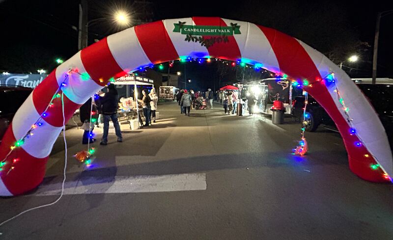 Food vendors brave the winter weather to serve visitors on Candy Cane Lane on Saturday, Nov. 30, 2024, during Oregon's Candlelight Walk.