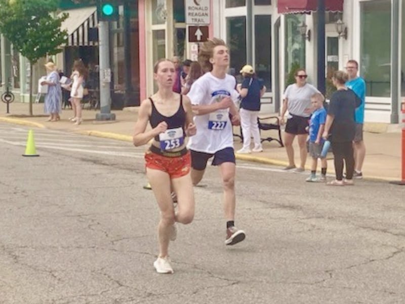 Payton Frueh, 16, of Ohio and Geoge Keutzer, 14, of Princeton finish the Princeton Mile Race Saturday morning.