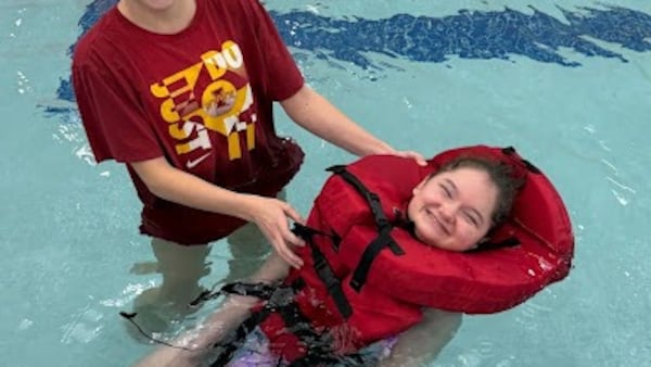 Oswego East parent group donates life vests to help swim class become more inclusive