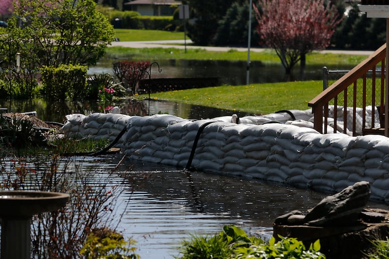 Sandbags protect a home in Holiday Hills  as flooding continues on the Fox River on Wednesday, April 22, 2026.