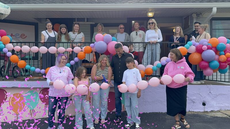 Owner of Geneva balloon styling and party goods store Twee Parties, Alissa Tadic, cuts the ribbon outside their new location at 500 Lark St. on May 22, 2025.
