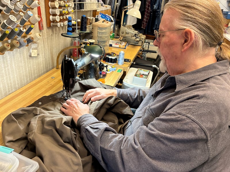 Tony Wiertz sews a patch onto an officers uniform on Thursday, Dec. 4, 2025, at Tony's Family Tailor Shop in McHenry. He plans to retire and close the store on Dec. 30.