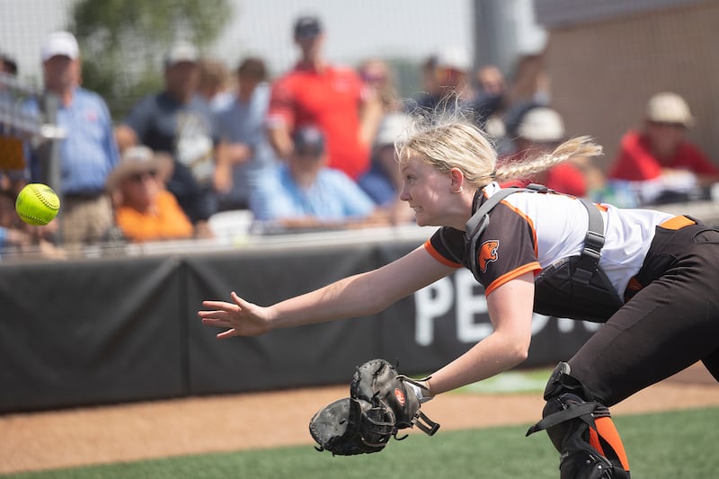 Gardner-South Wilmington’s Kayla Scheuber reaches for a pop-up against Waltonville Thursday, June 4, 2026, in the Class 1A softball semifinal in Peoria.