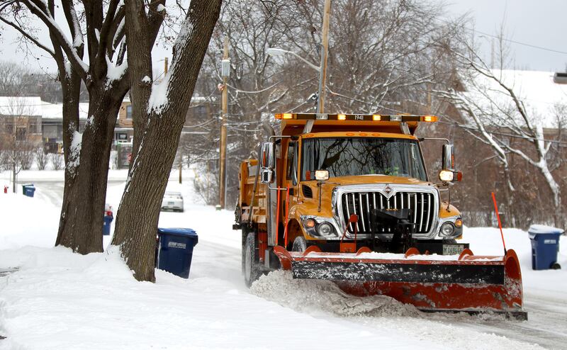 A St. Charles snow plow clears one of the city's streets after several inches of snow fell the morning of Monday, Jan. 24, 2022.