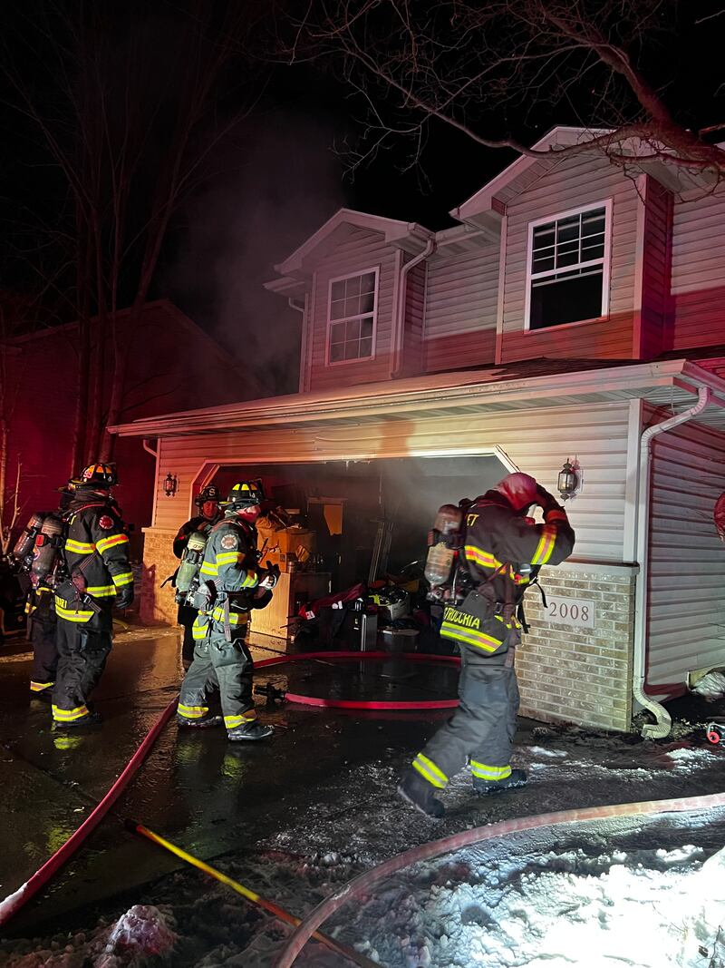 Joliet firefighters at the scene of an early morning house fire in the 2000 block of Addleman Street in Joliet on Sunday, Feb. 1, 2026.