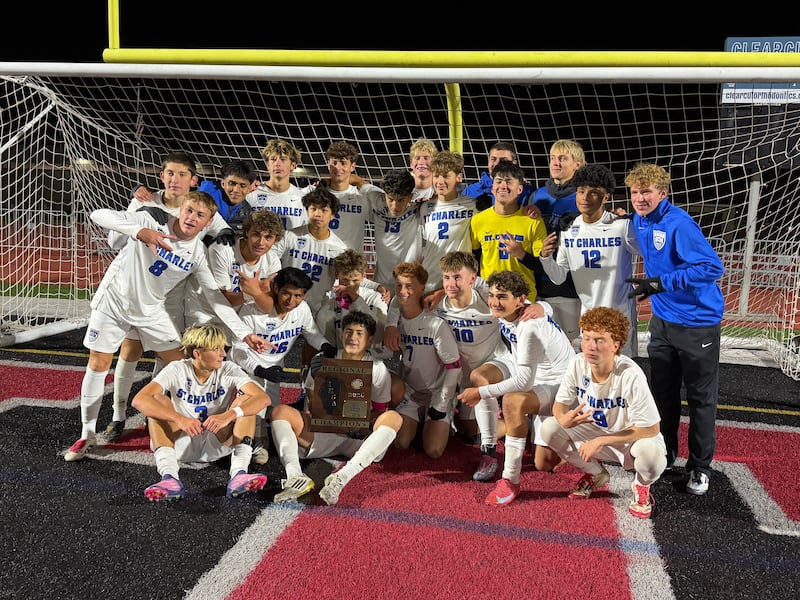 St. Charles North celebrates winning the Class 3A Huntley Regional championship on Friday, Oct. 24 at Huntley High School.