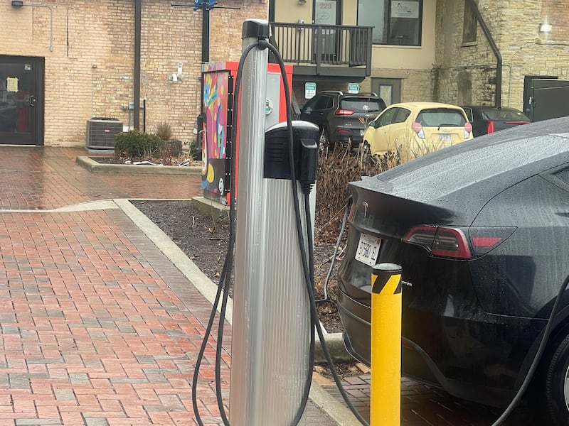 An Electric Vehicle charging station is seen in use Wednesday, March 5, 2025, in Van Buer Plaza in downtown DeKalb.