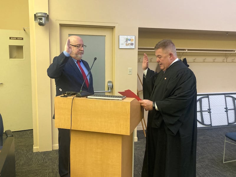 Will County Circuit Court Judge Donald DeWilkins swears in Michael Carroll as the new Lockport City Attorney on Wednesday, April 16, 2025.