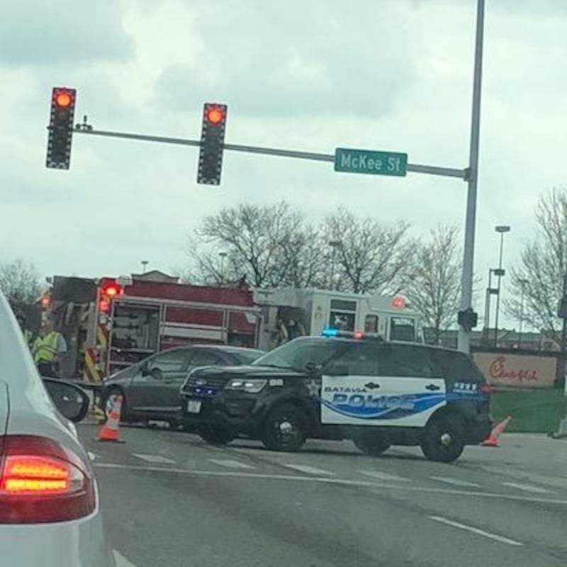 Officials deal with a traffic collision at Randall Road and McKee Street in Batavia in an undated file photo.