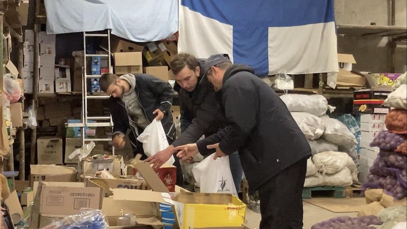 Donations made in 2022 by the Christian Worship Center in Lombard are sorted through after arriving in Ukraine.