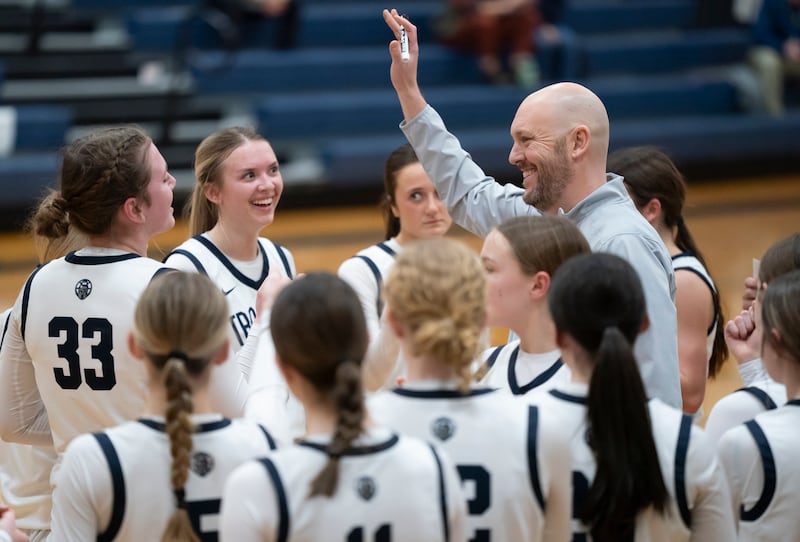 Cary-Grove head coach Tony Moretti celebrates with his team after defeating Lake Forest during the Class 3A Cary-Grove Regional Girls Basketball Championship game on Thursday, February 20, 2025 in Cary. Ryan Rayburn for Shaw Local