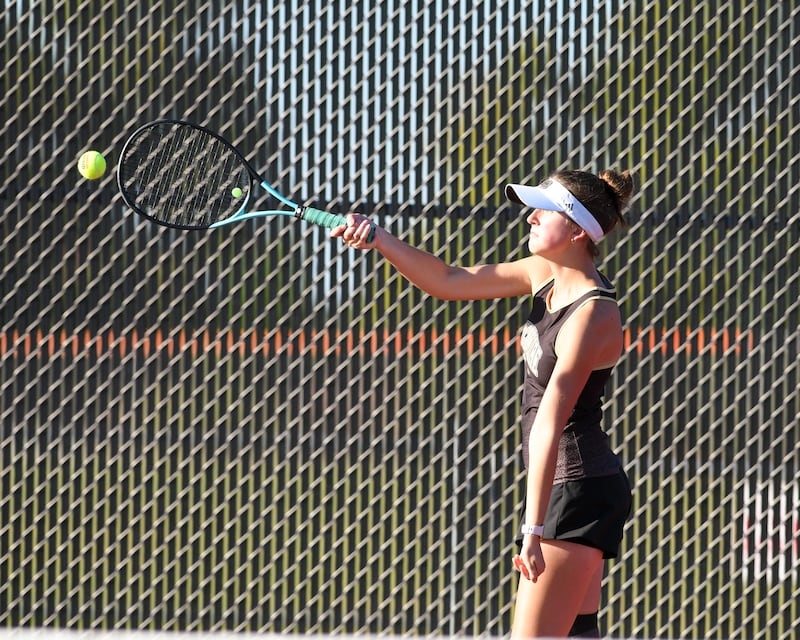 Sycamore’s Maysen Pethoud returns a volley in the first singles match while taking on Sycamore on number one singles Thursday Sept. 25, 2025, held at DeKalb High School.