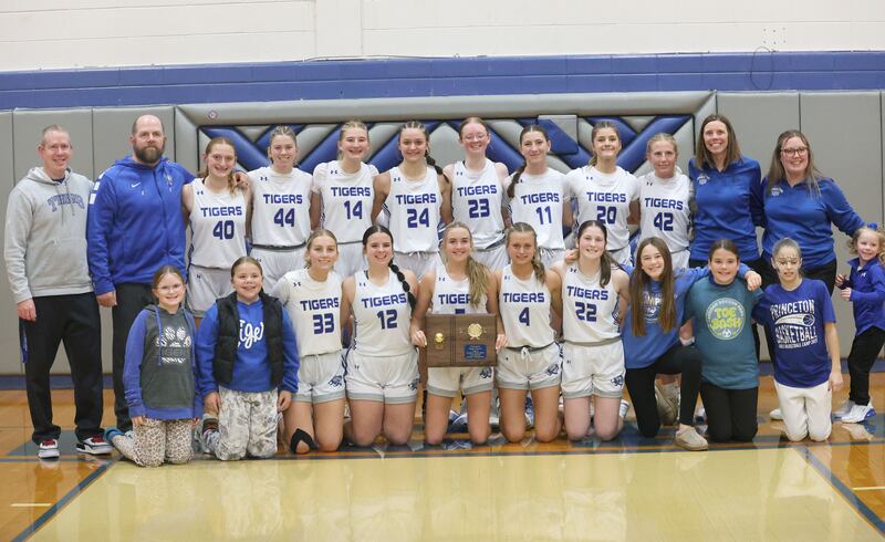 Members of the Princeton girls basketball team pose with the plaque after defeating Illinois Valley Central in the Princeton High School Girls Basketball Holiday Tournament on Saturday, Nov. 22, 2025 at Princeton HIgh School. The Lady Tigers won in double overtime.