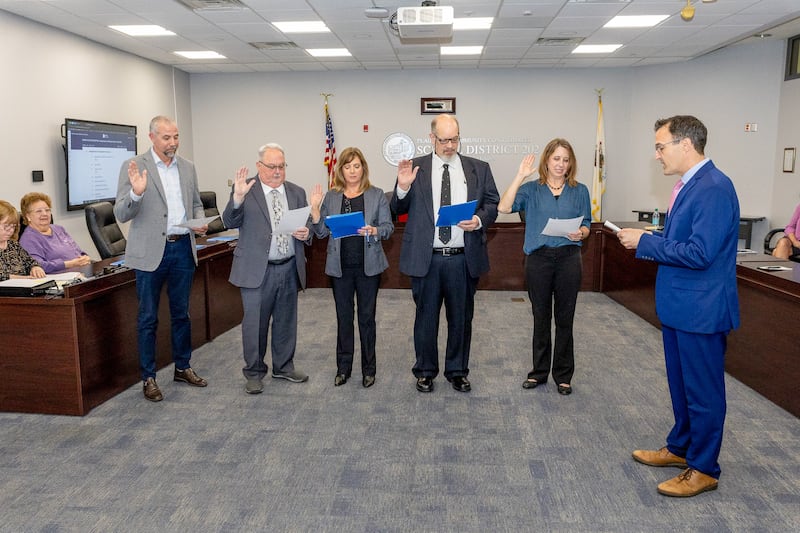 Plainfield Community Consolidated School District 202 Board of Education Incumbents Dr. Johua Ruland (from left) and Rod Westfall, and new members Nora Dalton and Greg Nichols, and incumbent Barbara Seiden take the oath of office on April 30, 2025. Board member and President Pro-Tem Elias Kalantzis (right) administers the oath.