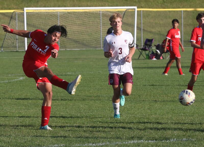 Ottawa's Jorge Lopez kicks the ball down the field as Illinois Valley Central's Drew Marquis lags behind on Monday, Oct. 7, 2024 at King Field.