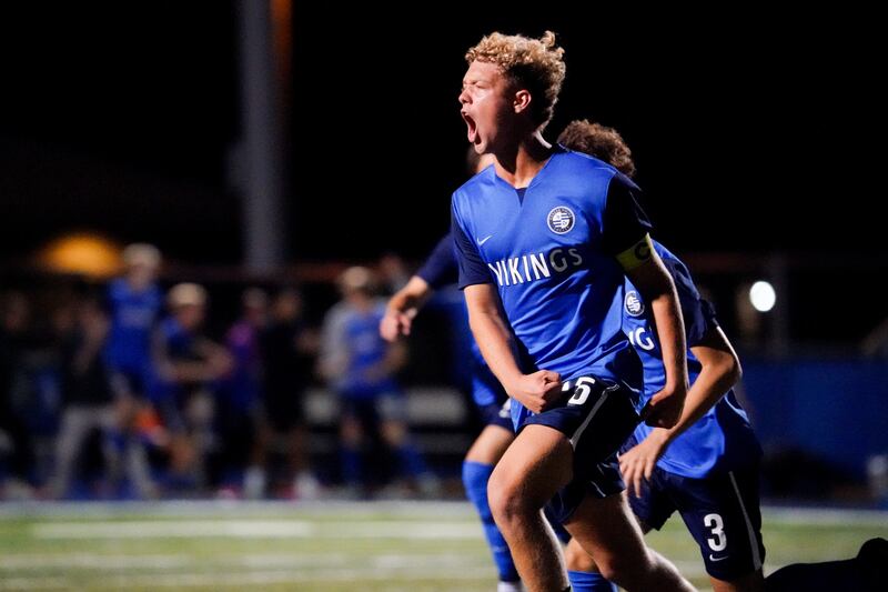 Geneva’s Benjamin Murphy (15) reacts after scoring a goal against St. Charles East during a DuKane Conference game at Geneva High School on Tuesday, Oct. 14, 2025.