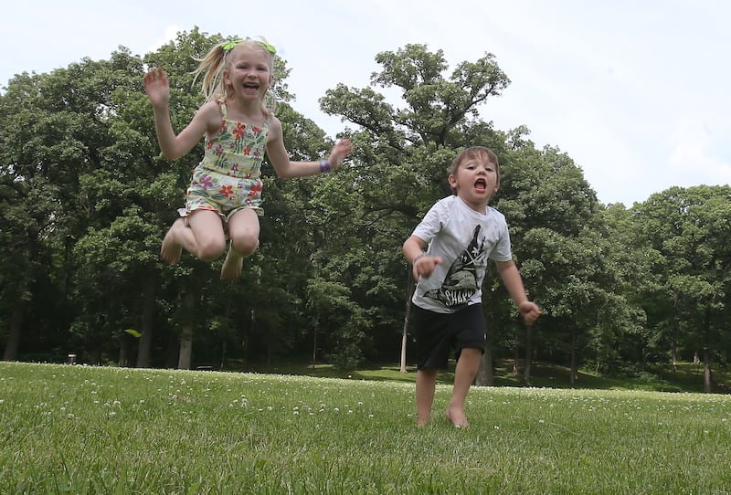 Kaibrey and Kaison Crank, play in a open grassy area where the future home of Logan's Oasis Playground will be built on Monday, June 16, 2025 at Marilla Park in Streator. Their father Logan died in a tragic accident in 2023 at age 26. Ground for the playground will be broken this summer. Constellation, La salle Clean Energy Center donated $36,000 to the project. A fun is also established through Starved Rock Country Community Foundation. Logan's Oasis is a non-for-profit organization with a beautiful mission to build a playground in Logan's memory that celebrates joy, inclusion and community at Marilla Park.