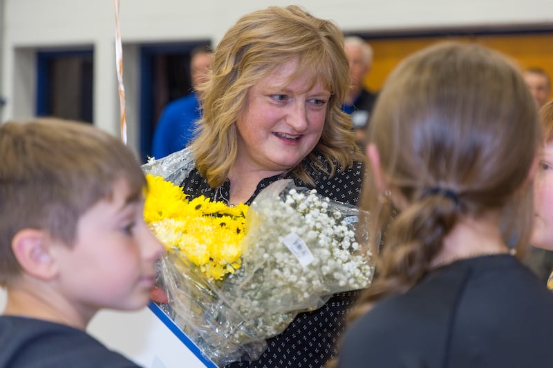 Students show their excitement as the Golden Apple Foundation on May 7 surprised Kristina Lancaster, a fourth-grade teacher at Big Hollow Elementary School in Ingleside, with the prestigious Golden Apple Award for Excellence in Teaching.