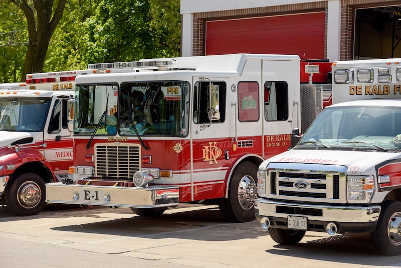 DeKalb Fire Station Number 1 with ambulance and fire trucks parked out front in DeKalb, IL